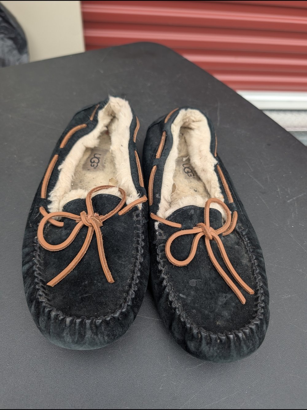 UGG Black Suede Shearling Moccasin Slippers with Chestnut Trim
